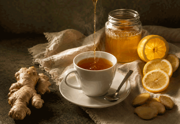 Queens Tahu ginger tonic poured with honey, lemon and fresh ginger